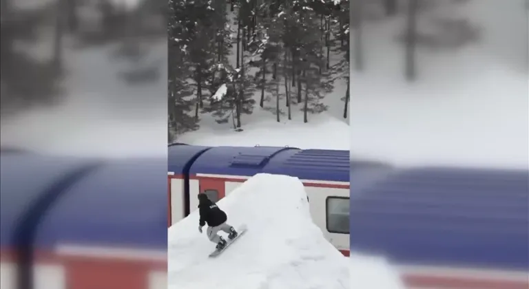 Turistik Doğu Ekspresi'ne dikkati çekmek için trenin üzerinden snowboard ile atladı